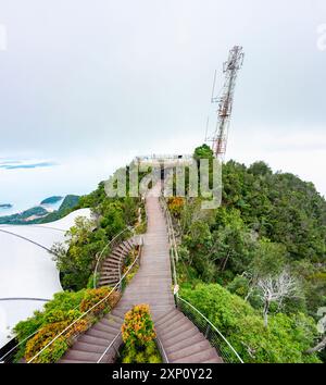 The steps and pathway,run over the high forested landscape,of Mat Cincang, the second highest mountain in Langkawi,as low cloud begins to roll in. Stock Photo