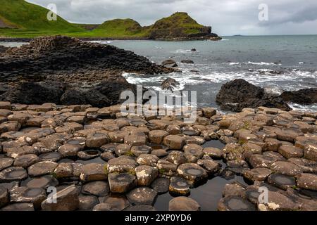 Giant's Causeway in County Antrim, Northern Ireland, UK. This large stretch of 40,000 black basalt columns is the result of cooled lava from volcanic eruptions that took place over 50 million years ago. Stock Photo