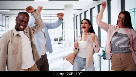 Business Fun Celebration And Teamwork Success. Corporate Team Dancing Stock Photo
