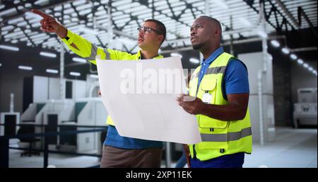 Factory Worker Osha Safety Inspection Using Blueprints Stock Photo
