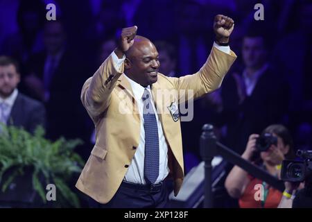 Canton, United States. 02nd Aug, 2024. 2024 Pro Football Hall of Fame inductee Dwight Freeney celebrates after receiving his gold jacket from hall of famer Bruce Smith during the gold jacket ceremony in Canton, Ohio, on Friday, August 2, 2024. Photo by Aaron Josefczyk/UPI Credit: UPI/Alamy Live News Stock Photo