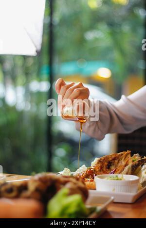 A variety of dishes are laid out on the table to prepare for family and friends banquets during New Year's Eve. Diverse food preparation ideas for fam Stock Photo