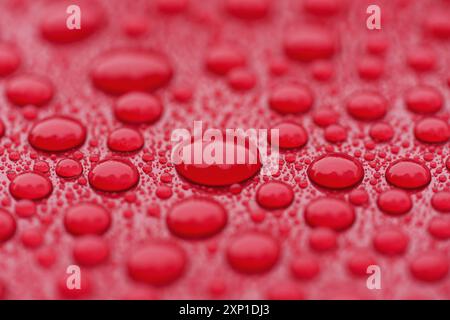 Closeup waterdrops on red ceramic coated paint surface Stock Photo