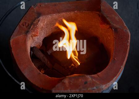 Close-up view of bonfire in charcoal stove Stock Photo