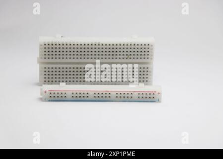 Breadboard with its power rails separated from the main part isolated on white background Stock Photo