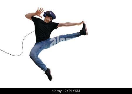 Young man in casual clothes using VR headset for playing game and imagin himself a fighter. Inovate intertainment technology Stock Photo