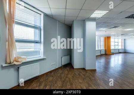 panorama view in empty modern office hall with sunlight in windows. Stock Photo