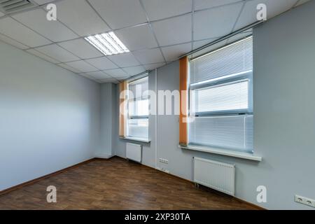 panorama view in empty modern office hall with sunlight in windows. Stock Photo