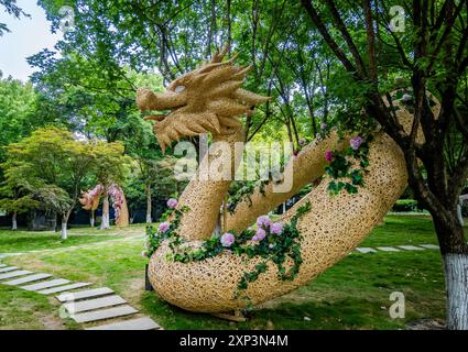 A large decorative dragon sculpture in a public park. Chengdu, Sichuan, China. Stock Photo