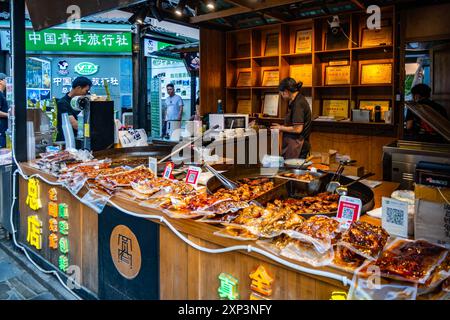 Local delicacies sold at store on a historical street. Chengdu, Sichuan, China. Stock Photo