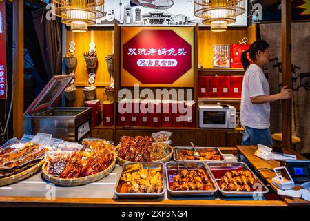 Local delicacies sold at store on a historical street. Chengdu, Sichuan, China. Stock Photo