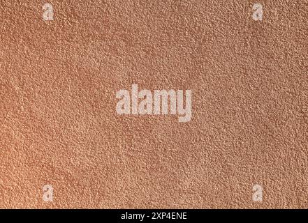 Orange or terracotta wall, texture, background. Decor of contrasting orange textured coating. Structural plaster, rough, uneven surface Stock Photo