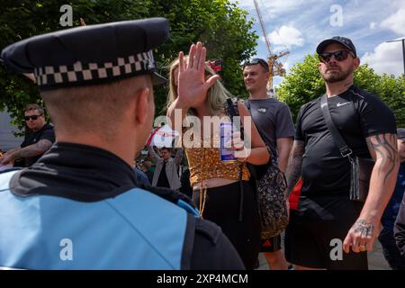 Saturday August 03 2024 Leeds City Centre United Kingdom, in the aftermath of the Southport attacks. Tommy Robinson Support /anti-immigration demonstration alongside an anti-racist and pro Palestine demonstration. The anti-racists outnumbered  the anti-immigration by 2-1. Two sides were separated by cordons and a  large police presence gathered around the 150 ‘patriot’ protesters on The Headrow in Leeds on Saturday (August 3). Protesters broke away several times to march around the city centre to return and goad the Palestine/anti-racist demonstrators. Stock Photo