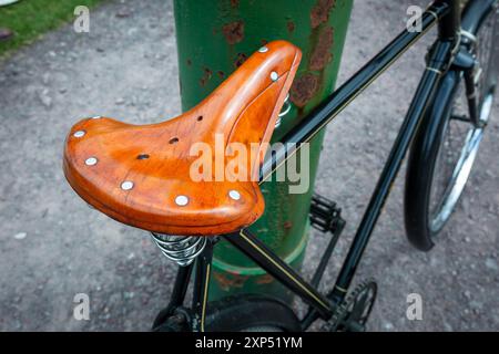 Old fashioned bicycle leather saddle Stock Photo