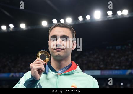 03 August 2024, Olympics, Paris 2024, swimming, 100m butterfly, men, Kristof Milak from Hungary celebrates with his gold medal. Photo: Marcus Brandt/dpa Stock Photo