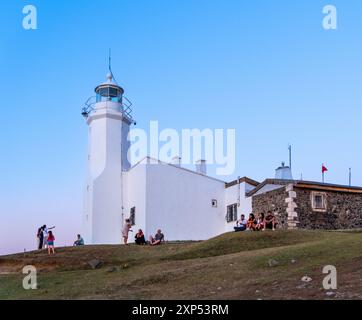 Sinop, Turkey, 07.30.2024: Stunning sunset view of Inceburun Lighthouse in Sinop, Turkey. The lighthouse silhouette against the colorful sky creates Stock Photo