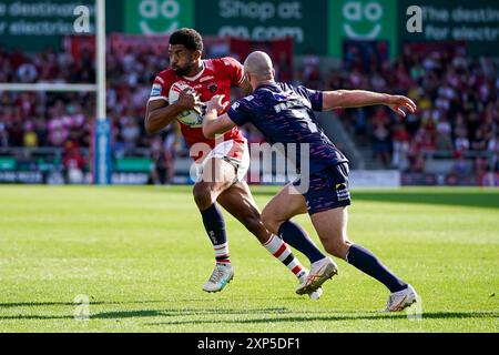 Salford, Manchester, UK. 3rd August, 2024. Super League Rugby: Salford Red Devils Vs Leeds Rhinos at Salford Community Stadium. Kallum Watkins looking to beat Matt Frawley on the outside during the first half of the game vs Leeds Rhinos. Credit James Giblin/Alamy Live News. Stock Photo