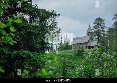 Pramollo memorial church, a small heritage church close to nassfeld or pramollo lake on high alpine pass between italy and austria. Cold summer day wi Stock Photo