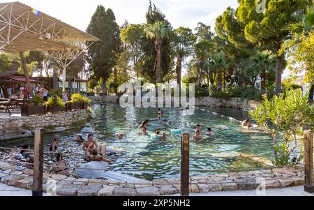 Pamukkale Turkey July 08 2024: Pamukkale Hierapolis ancient city and swimming pool, which is on the UNESCO world heritage list Stock Photo