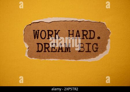 DREAMS DONT WORK UNLESS YOU DO motivational quote written in notebook. Stock Photo