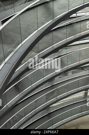 Berlin, Germany - Dec 20, 2023 - A curved walkway stretches in spirals upwards on top inside the glass dome constructed of the Reichstag building. Con Stock Photo