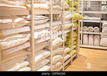 pillows and blankets on the counter in the supermarket everything for the home Stock Photo