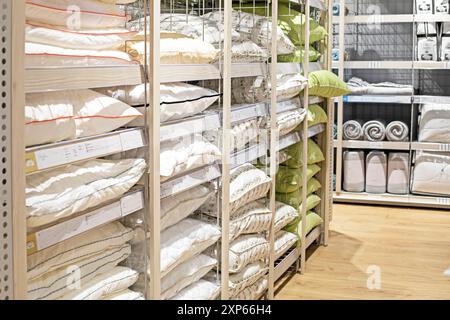 pillows and blankets on the counter in the supermarket everything for the home Stock Photo