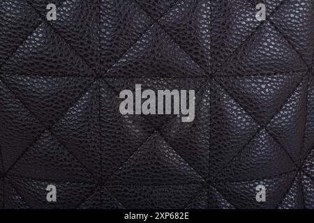 Swatch of leather texture with stitched pattern in the form of squares, triangles and rhombus Stock Photo