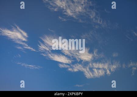 Wispy White Clouds on a Clear Blue Sky Stock Photo