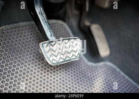 Hybrid electric car interior element, metal gas accelerate and brake pedal. Sport car with automatic gearbox controls. Stock Photo