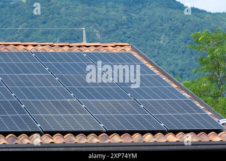 Solar panels on the roof to save energy and money Stock Photo
