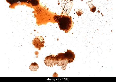 Drops, smear of spilled black coffee on white as texture or background Stock Photo
