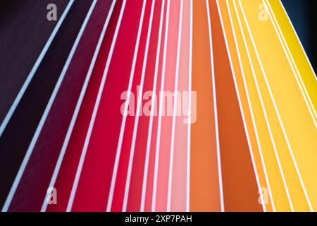 A background of white diagonal lines separating vibrant bands of colors in a fan shape. Stock Photo