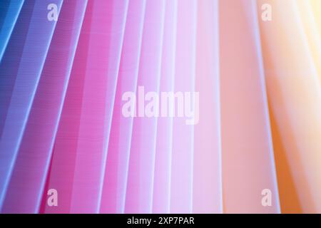 Gauzy bands of a gradient color background in shades of blue, pink, and yellow. Stock Photo