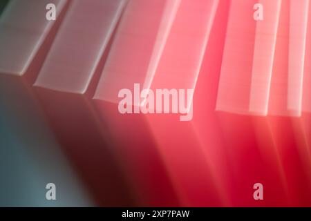 Blocks of red motion blur shapes created from paper during long exposure. Stock Photo