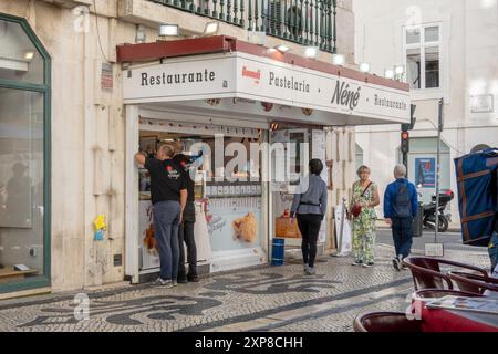 Customers Outside The Pastelaria Nene Lisbon Portugal A Restaurant And Cafe In Central Lisbon On Rua Augusta, April 16, 2024 Stock Photo