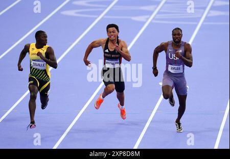 (left to right) Jamaica’s Oblique Seville, Great Britain’s Louis Hinchliffe and USA’s Noah Lyles in action in the 100m Semi-Final one at the Stade de France on the ninth day of the 2024 Paris Olympic Games in France. Picture date: Sunday August 4, 2024. Stock Photo