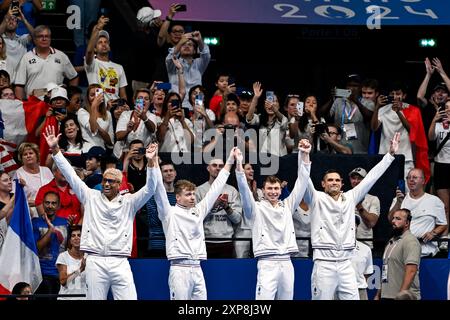 Paris, France. 04th Aug, 2024. Athletes of team France celebrate after winning the bronze medal in the swimming 4x100m Medley Relay Men Final during the Paris 2024 Olympic Games at La Defense Arena in Paris (France), August 04, 2024. Credit: Insidefoto di andrea staccioli/Alamy Live News Stock Photo