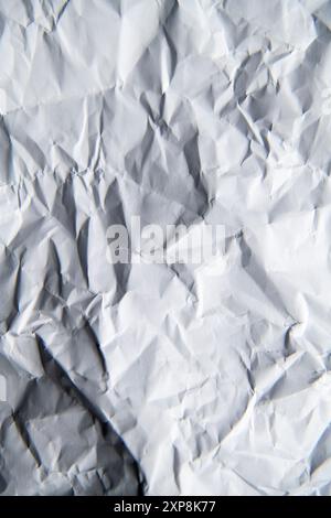 Detail of a crumpled sheet of white A4 paper Stock Photo