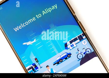 London. UK- 07.28.2024. The welcome page of the third party mobile and online payment platform in a smart phone isolated in white. Stock Photo