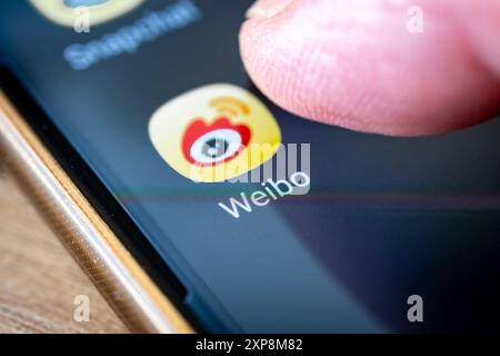 London. UK- 07.28.2024. The Chinese microblogging social media platform app Weibo on the screen of a smart phone. Stock Photo