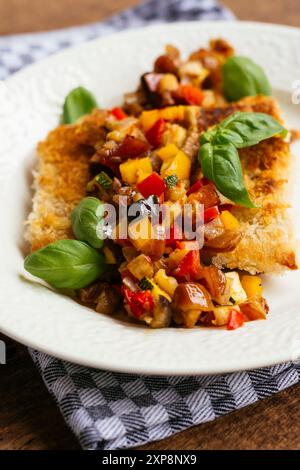 Tempeh Fillet with Date Ratatouille Relish (red onion, red bell pepper, yellow bell pepper, zucchini, eggplant, dates) Stock Photo