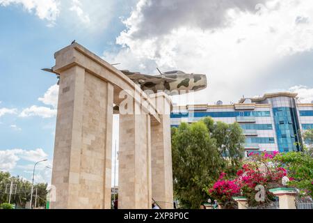 Old war memorial with soviet jet fighter and modern buildings in the  downtown streets of Hargeisa, Somaliland, Somalia Stock Photo