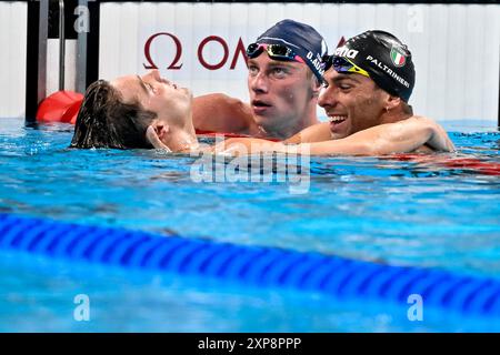 Paris, France. 04th Aug, 2024. Bobby Finke of United States of America, gold and new world record, David Aubry of France, and Gregorio Paltrinieri of Italy, silver react after competing in the swimming 1500m Freestyle Men Final during the Paris 2024 Olympic Games at La Defense Arena in Paris (France), August 04, 2024. Credit: Insidefoto di andrea staccioli/Alamy Live News Stock Photo