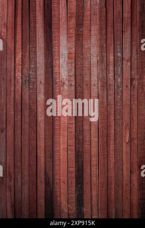 Front view of an old, aged and rustic wooden wall painted in red. Abstract full frame textured background, copy space. Stock Photo