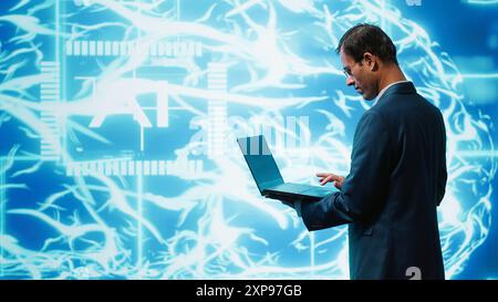 System administrator working on laptop, programming artificial intelligence computing simulating human brain. Man in workspace using notebook, building AI machine learning algorithms, camera A Stock Photo