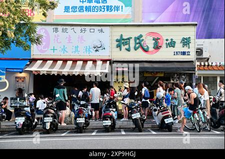 Taiwan - Aug 03, 2024: Experience Jiaoxi's top culinary delights with Wu's Peanut Roll Ice Cream and Ko's Scallion Pancakes, beloved by locals and a m Stock Photo