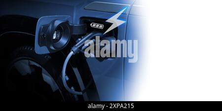 Power cable pump plug in charging power to electric vehicle EV car. Stock Photo