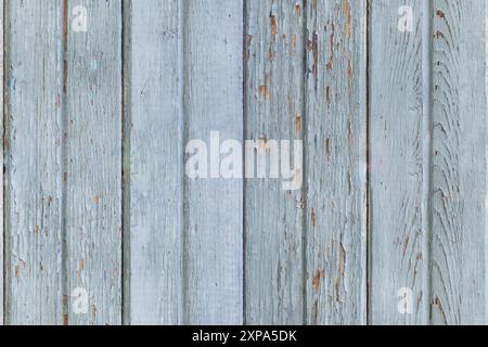 A seamless pattern featuring rustic, weathered wooden planks with peeling paint, creating a nostalgic and vintage backdrop. Stock Photo