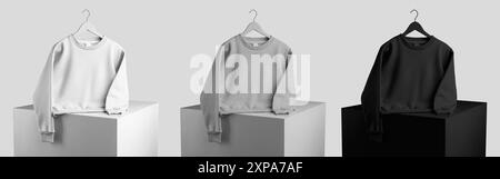 Mockup of white, black, heather female crop sweatshirt on hanger, presentation on cube, isolated on background, front view. Template of fashionable wo Stock Photo